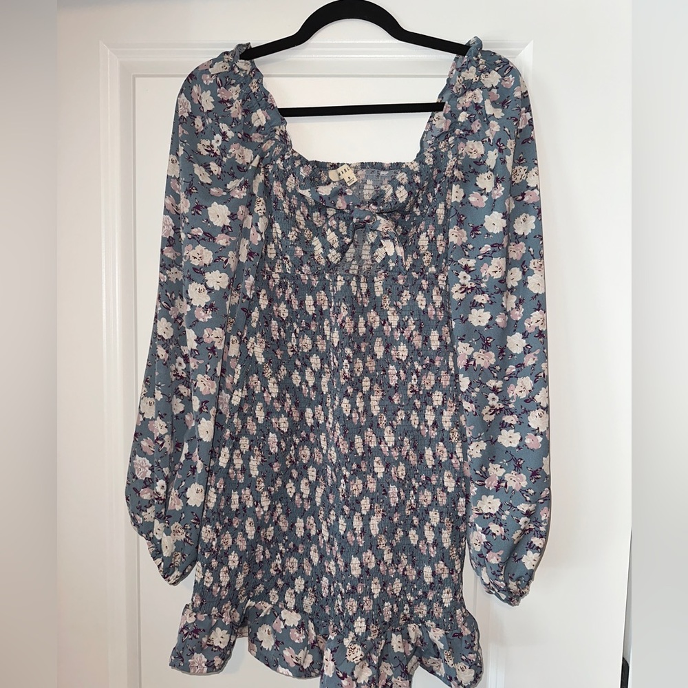 Blue dress, opening in front, super cute ruffle details. Worn once